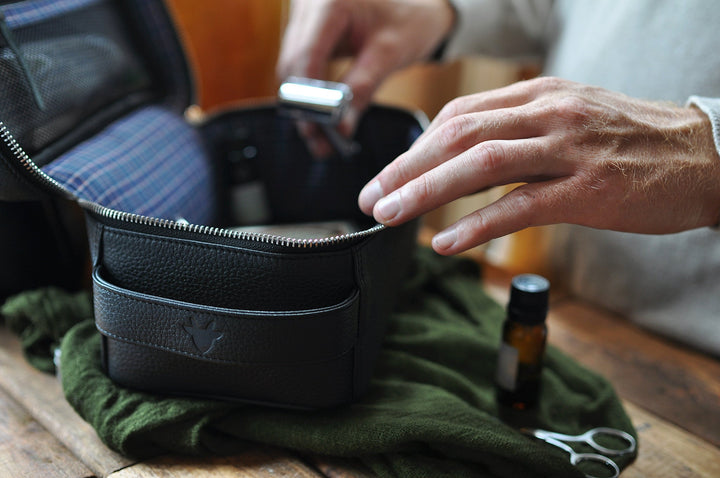Handcrafted leather dopp kit with a zipper closure, for travel and grooming essentials.