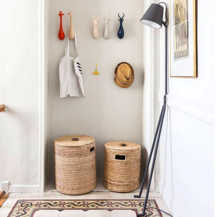 Natural palm Malawi basket with wooden handle, showing the woven texture.