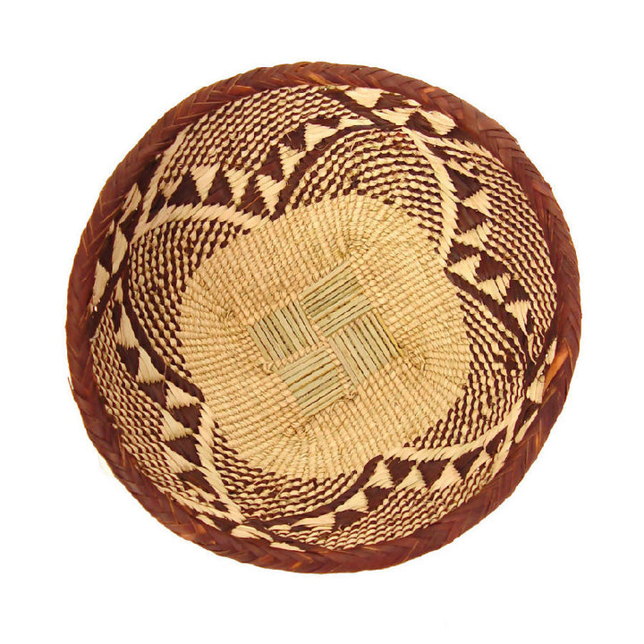 Handwoven Tonga basket bowls in natural fiber, shallow and sculptural.