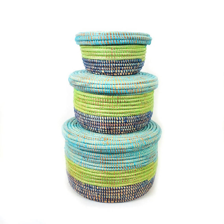 Coastal-blue handwoven storage baskets with sturdy handles and textured weave.