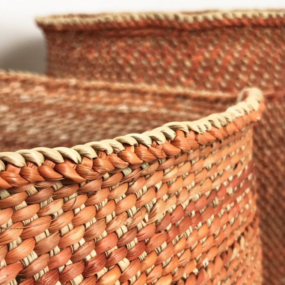Handwoven auburn Iringa basket, natural fiber with a spacious interior.