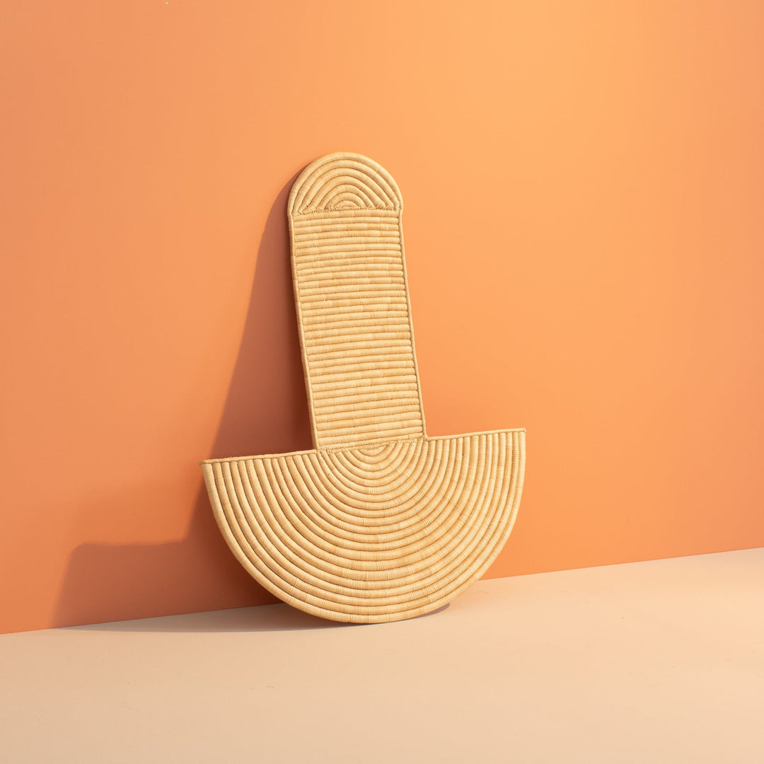 All-natural woven wall mask with a ribbed column and arched top above a wide half-moon fan base.