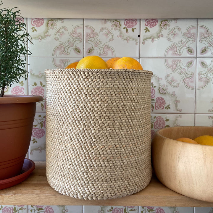 Natural undyed Iringa basket, woven Milulu grass for storage and rustic decor.