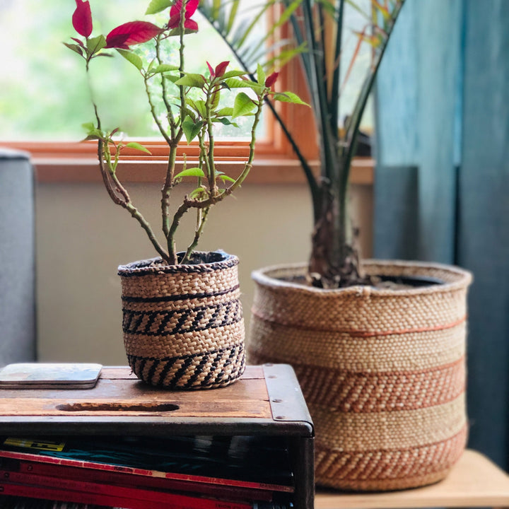 Handwoven auburn stripe Iringa basket with bold stripes, Tanzanian Milulu grass.