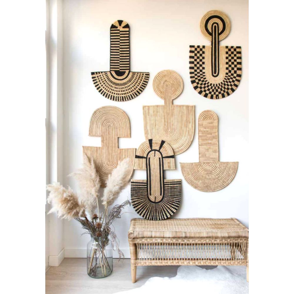 Abstract woven palm leaf wall mask with intricate texture, made in Malawi.