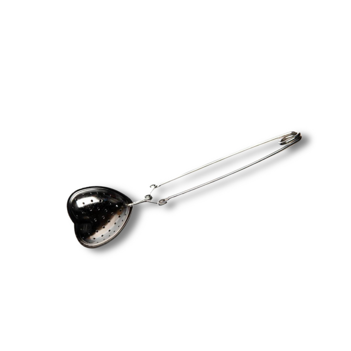 Heart-shaped stainless steel tea infuser with fine mesh for loose-leaf tea.