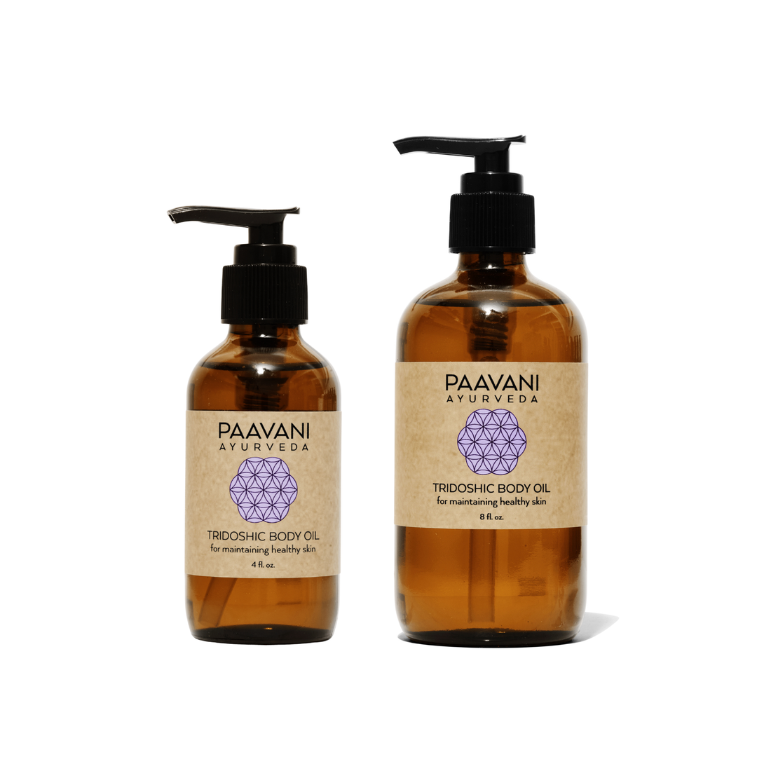 Tridoshic Ayurvedic body oil in a glass bottle.