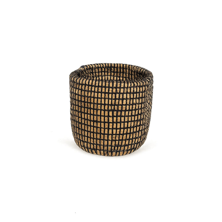Rustic handwoven basket planter holding small succulents.