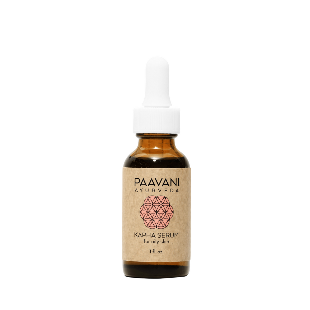 Kapha face oil, a lightweight Ayurvedic face oil, in a glass bottle.
