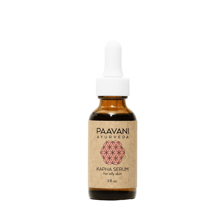 Kapha face oil, a lightweight Ayurvedic face oil, in a glass bottle.