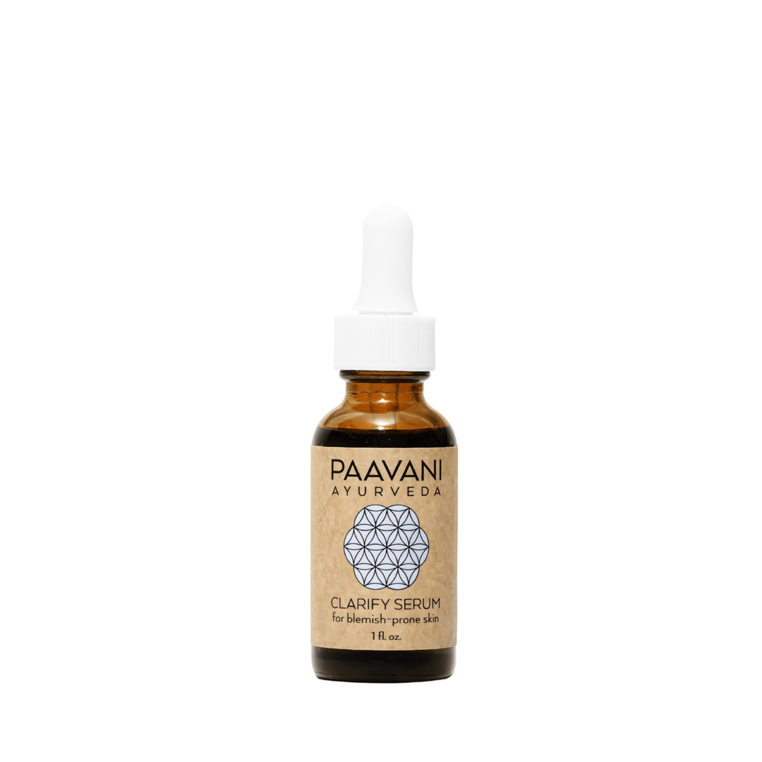 Organic Clarify face serum in a clear glass dropper bottle with herbal ingredients.