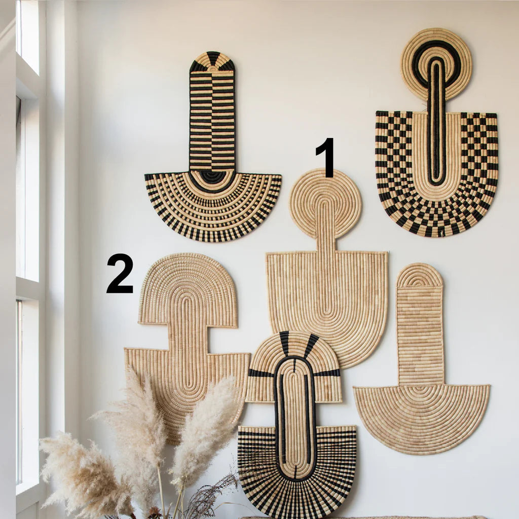 Natural-fiber woven wall mask with concentric coil texture, contemporary African-inspired wall art.