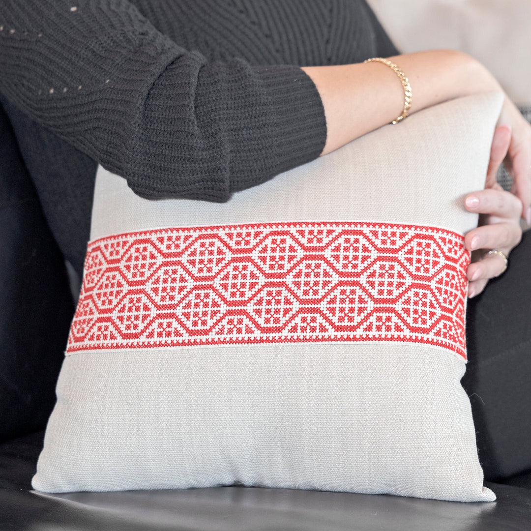 Palestinian red tatreez pillow cover, hand cross-stitched on natural cotton.