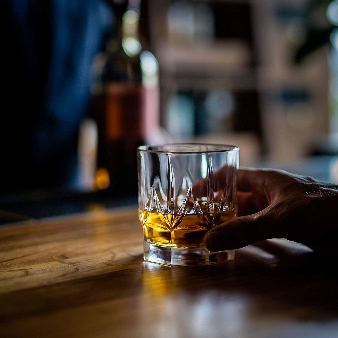 Handcrafted crystal whiskey tumblers with smooth glass surfaces for sipping whiskey.