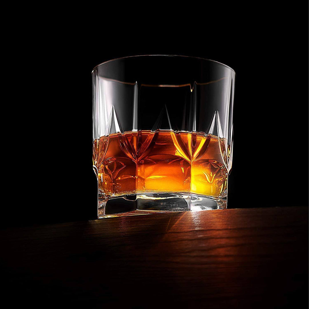 Set of crystal whiskey tumblers, handcrafted glassware for serving spirits.