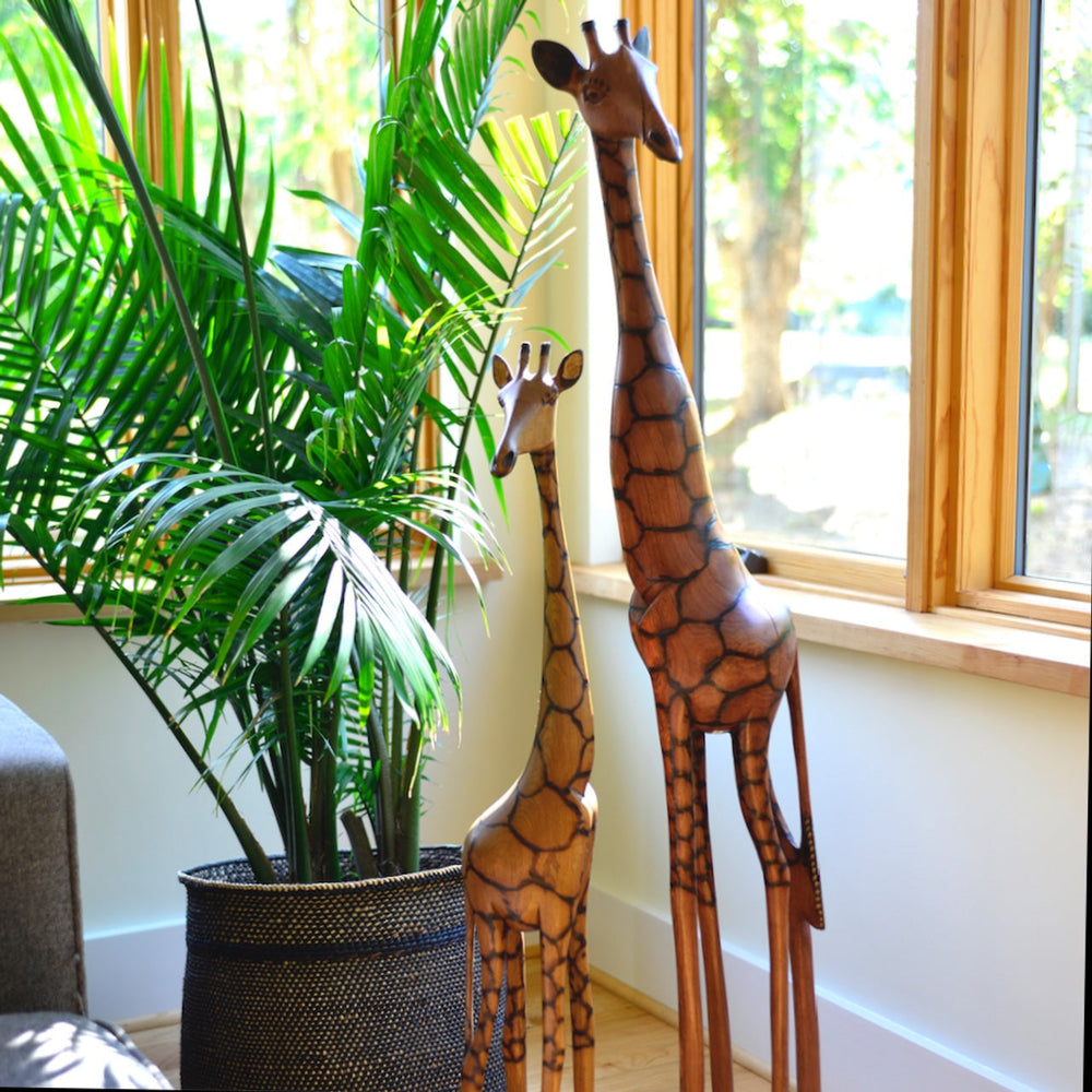24-inch olivewood giraffe sculpture, hand-carved with a smooth natural finish.