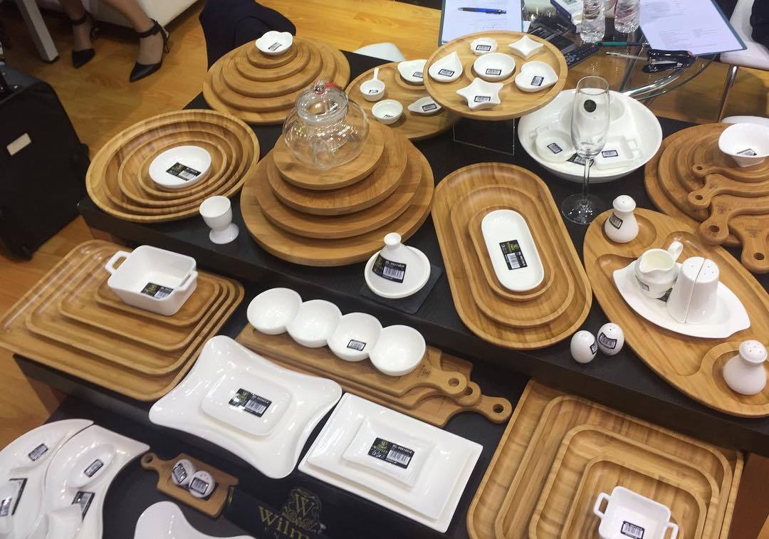 Bamboo round serving platter with two sections, natural style.