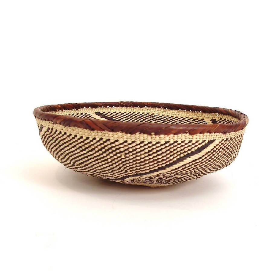 Tonga basket bowls, rounded handwoven natural-fiber bowls with a textured weave.