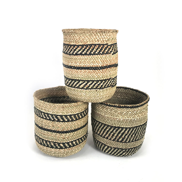 Handwoven black stripe Iringa storage basket with a sturdy woven design.