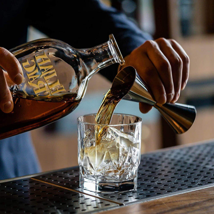 Set of handcrafted crystal whiskey tumblers with a clear, elegant glass design.