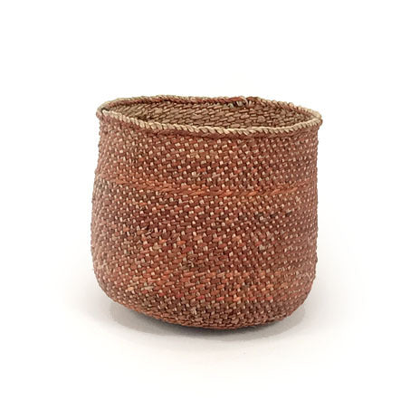 Handwoven auburn Iringa storage basket in natural Milulu grass