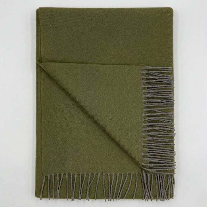 Handwoven baby alpaca throw blanket in olive, 51 by 71 inches with a brushed finish.