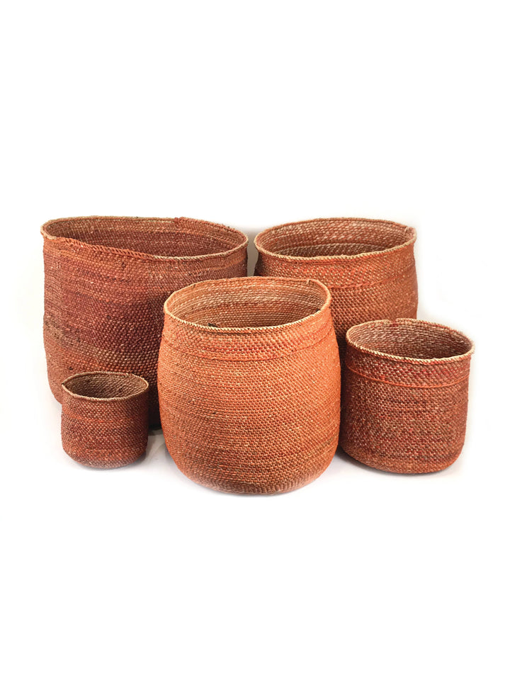 Auburn Iringa basket handwoven from milulu grass dyed a warm terracotta