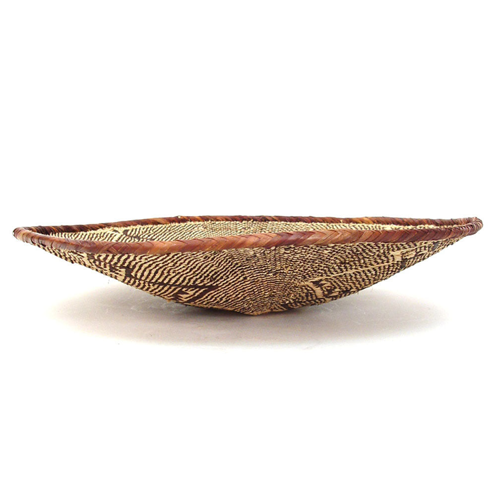 Large Tonga storage basket, woven natural fiber for home organization.