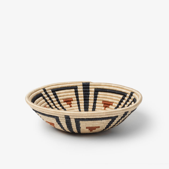 Medium Akazi woven bowl in burnt orange, black, and tea-toned sisal.