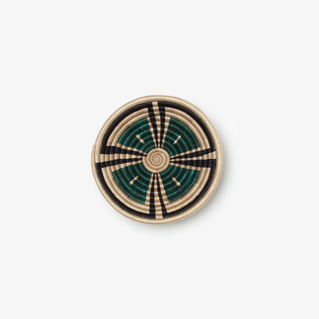 Small Akazi woven bowl in hunter green, black, and tea-toned sisal.