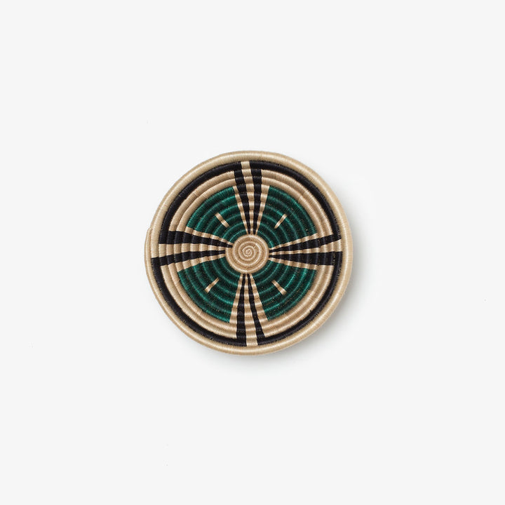 Small Akazi woven bowl in hunter green, black, and tea-toned sisal.