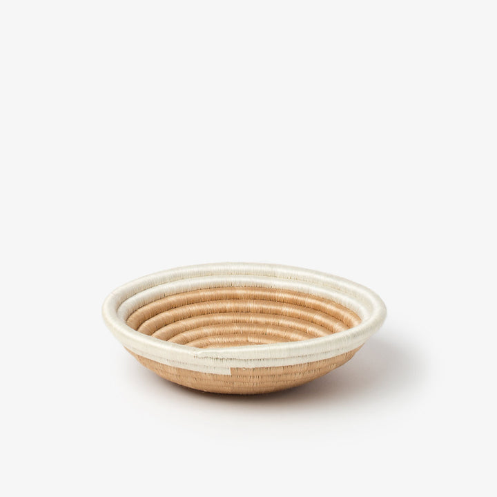 Small Aura woven bowl with a white rim band over natural tea-toned sisal.