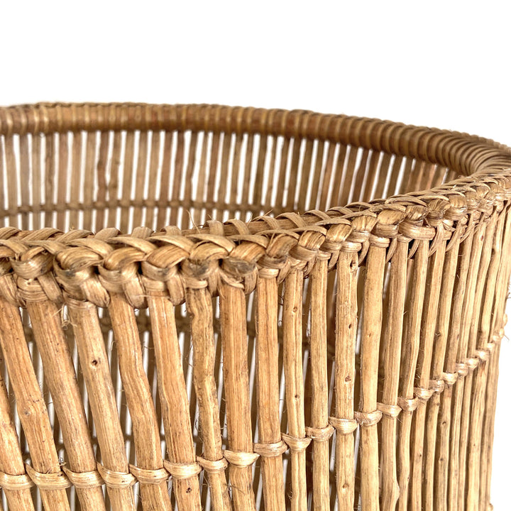 Woven Lozi fishtrap basket for storage, natural reed texture.