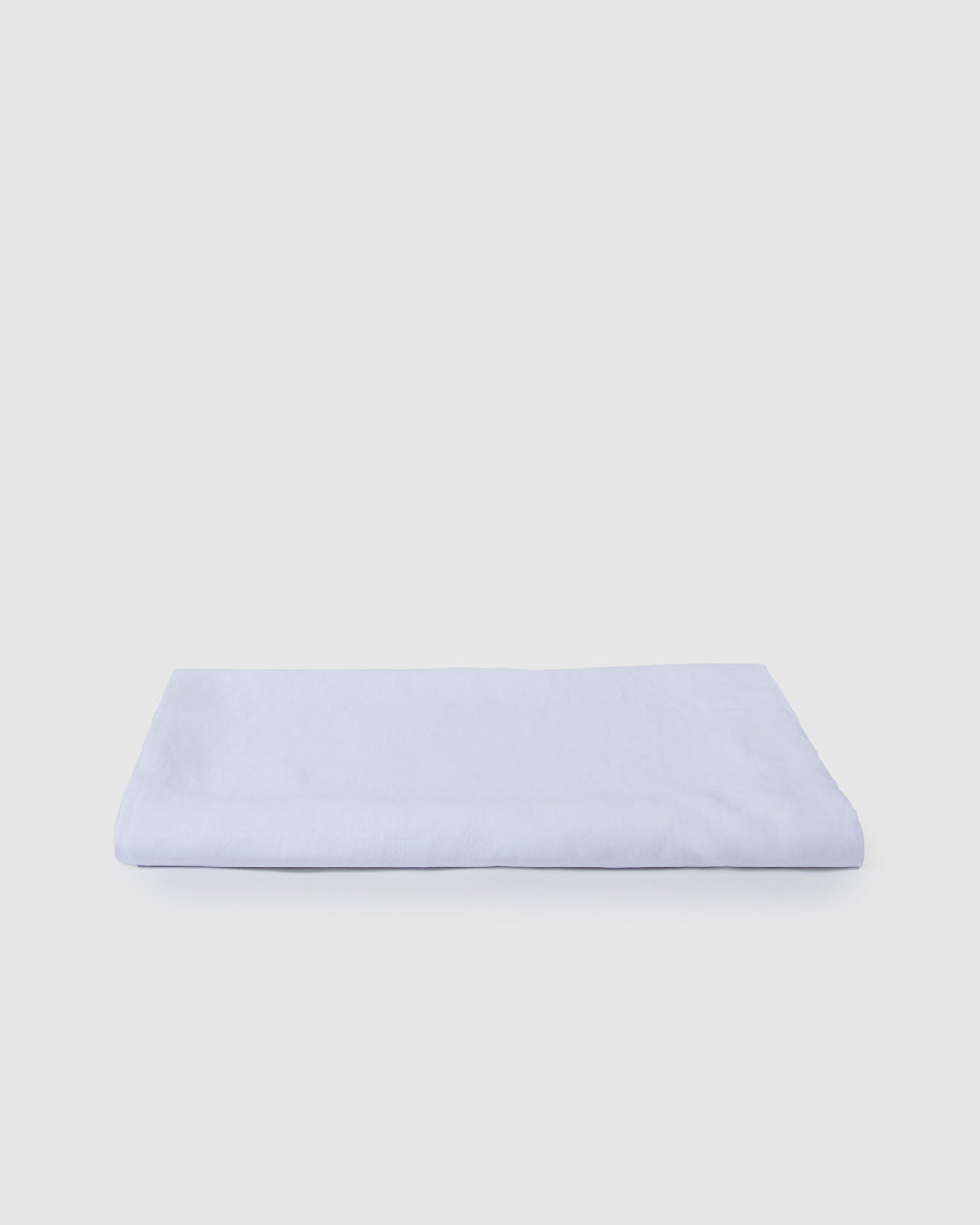 Light beige linen tablecloth with a smooth milk color, showcasing a soft, elegant fabric suitable for dining tables.