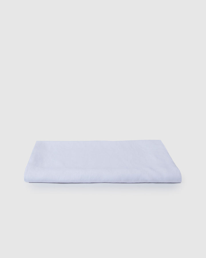 Light beige linen tablecloth with a smooth milk color, showcasing a soft, elegant fabric suitable for dining tables.