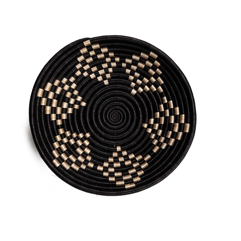 Overhead view of Bariku woven bowls in black and tan sisal with intricate weaving.