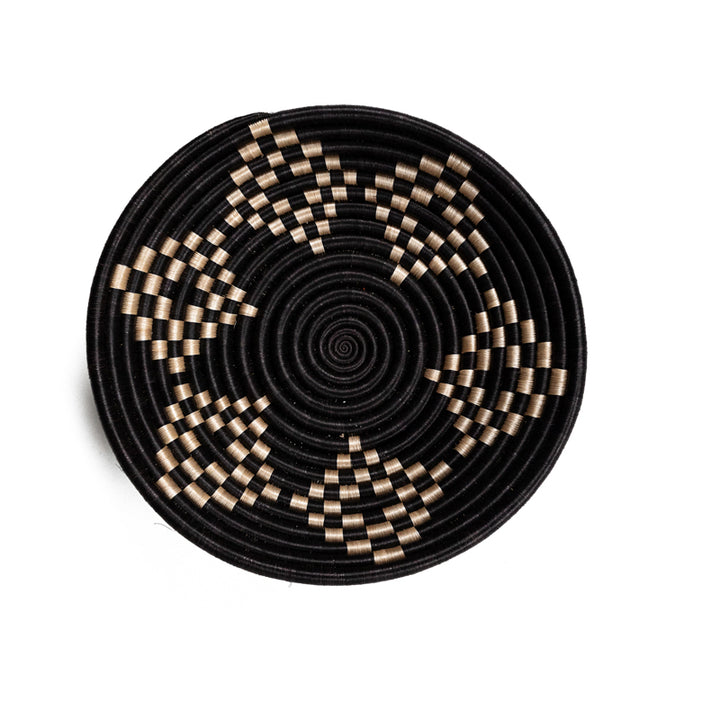 Overhead view of Bariku woven bowls in black and tan sisal with intricate weaving.