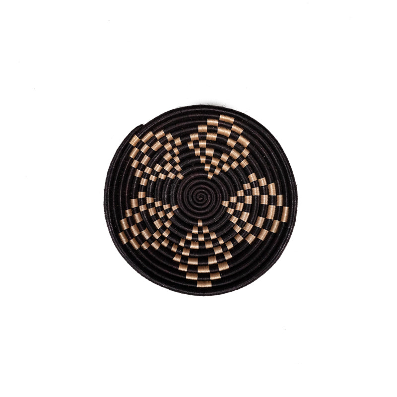 Overhead view of Bariku woven bowls with a textured black and tan handwoven design.
