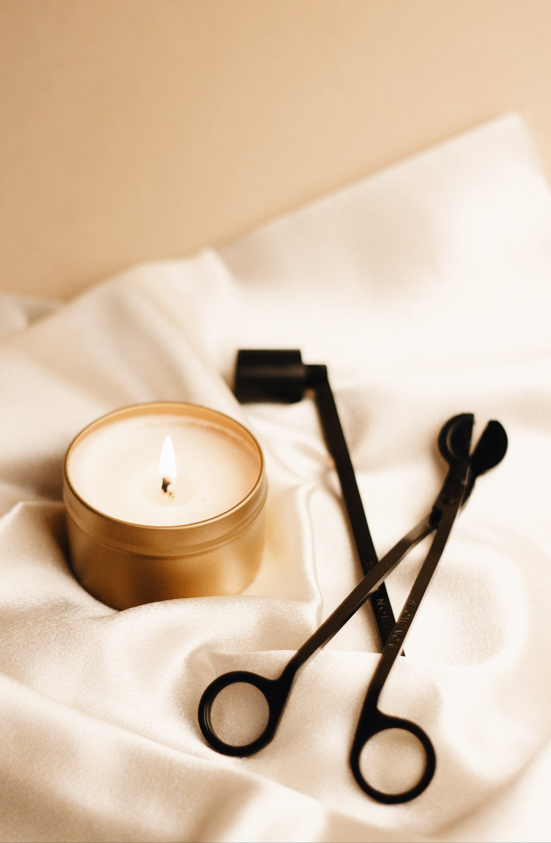 Candle care set with wick trimmer and snuffer in matte black finish.