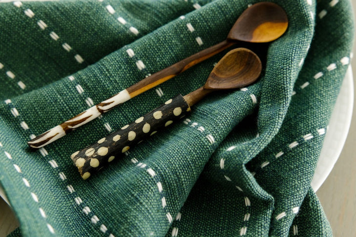 Cedar cocktail napkin under wooden spoons, showing the woven line pattern