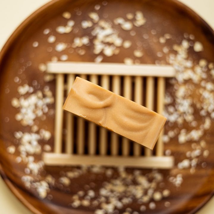 Cold-process bar soap with creamy texture and natural ingredient inclusions.