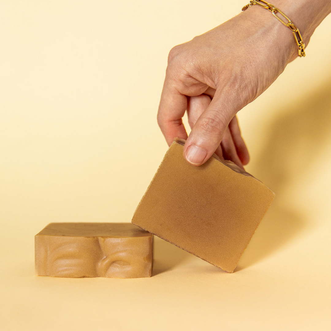 Cream-colored bar soap with rustic, package-free presentation.