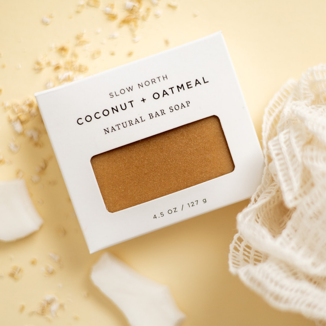 Coconut oatmeal bar soap with textured surface showing oatmeal and coconut elements.