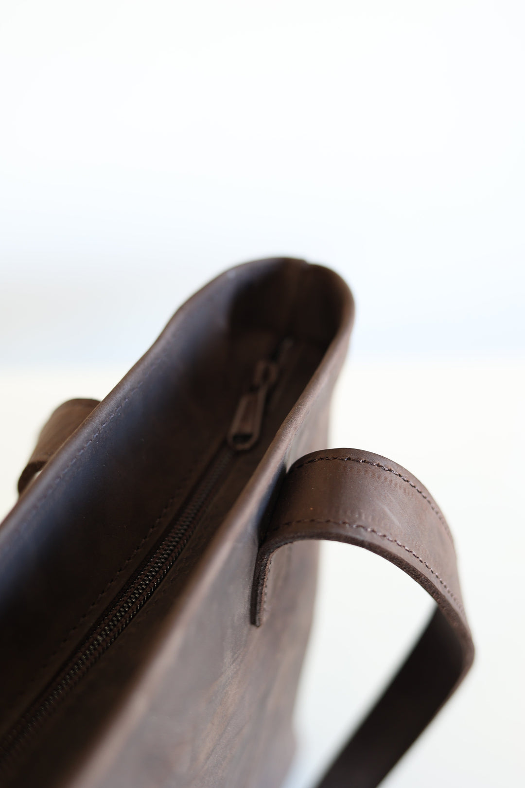 Leather tote with sturdy shoulder straps for daily use.
