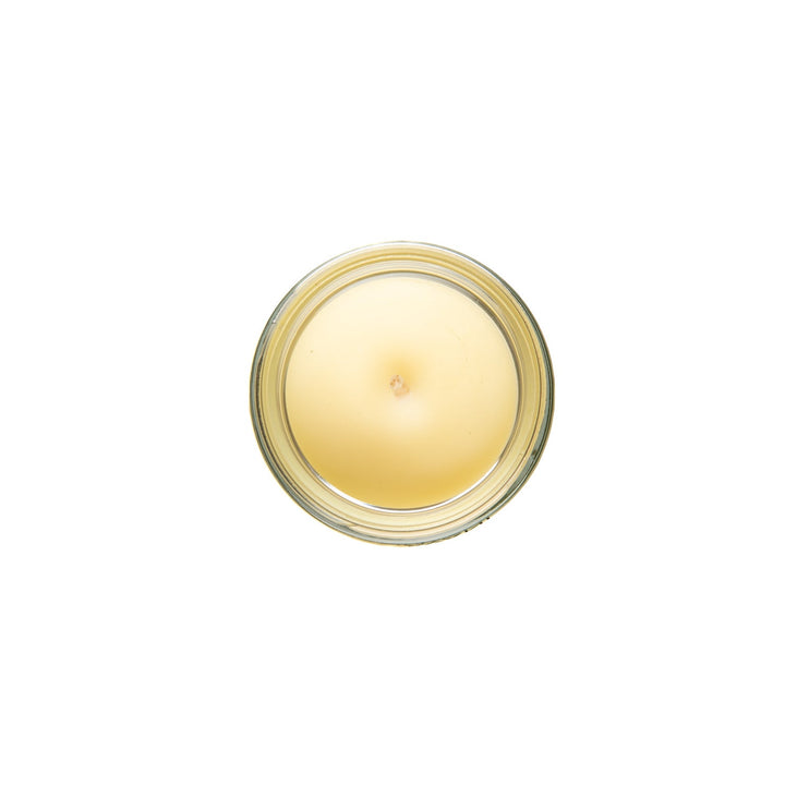 Organic ghee trataka meditation candle in a clear holder.