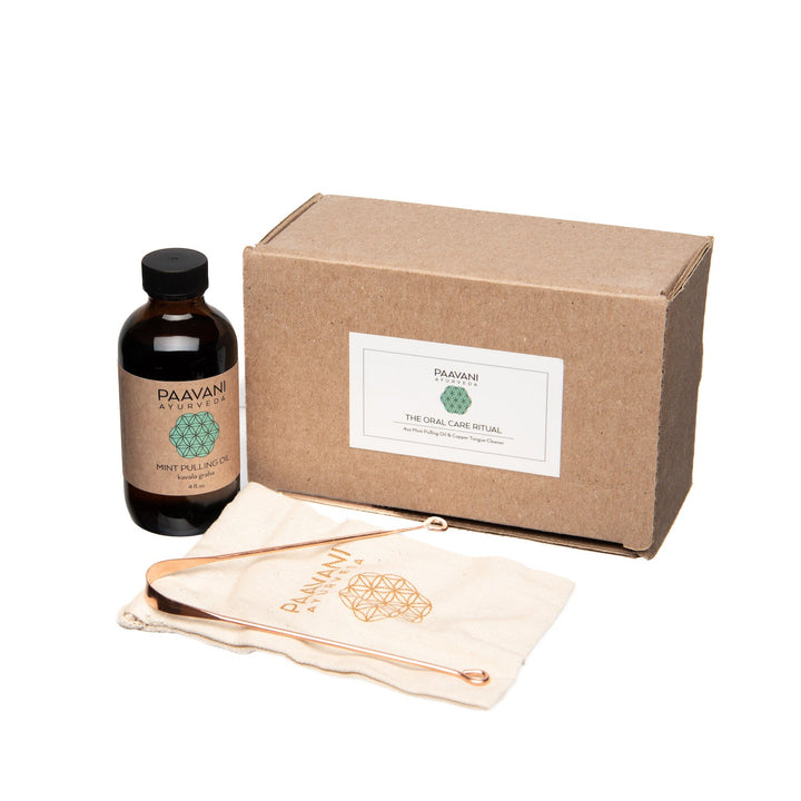 Ayurvedic oral care kit with natural tools and herbal pulling oil for oral hygiene.