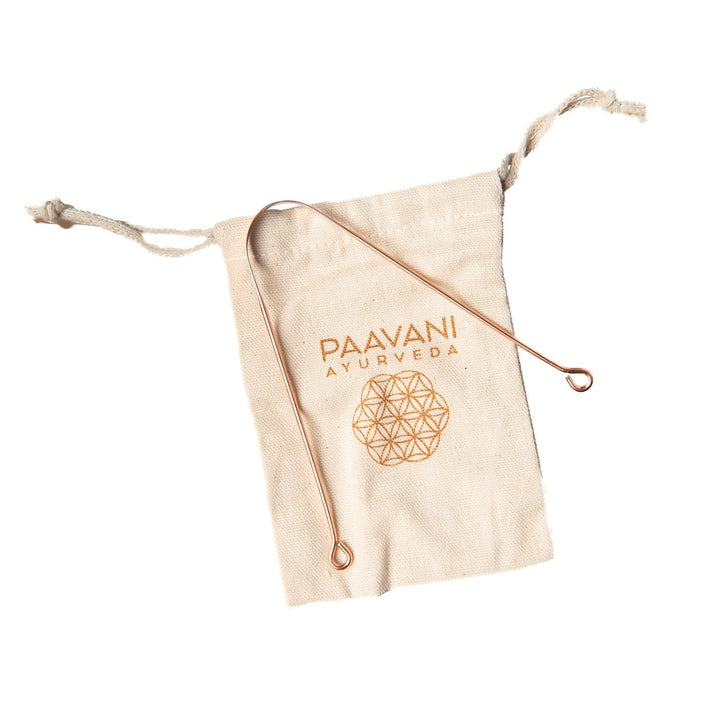 Copper tongue cleaner with a traditional Ayurvedic design.