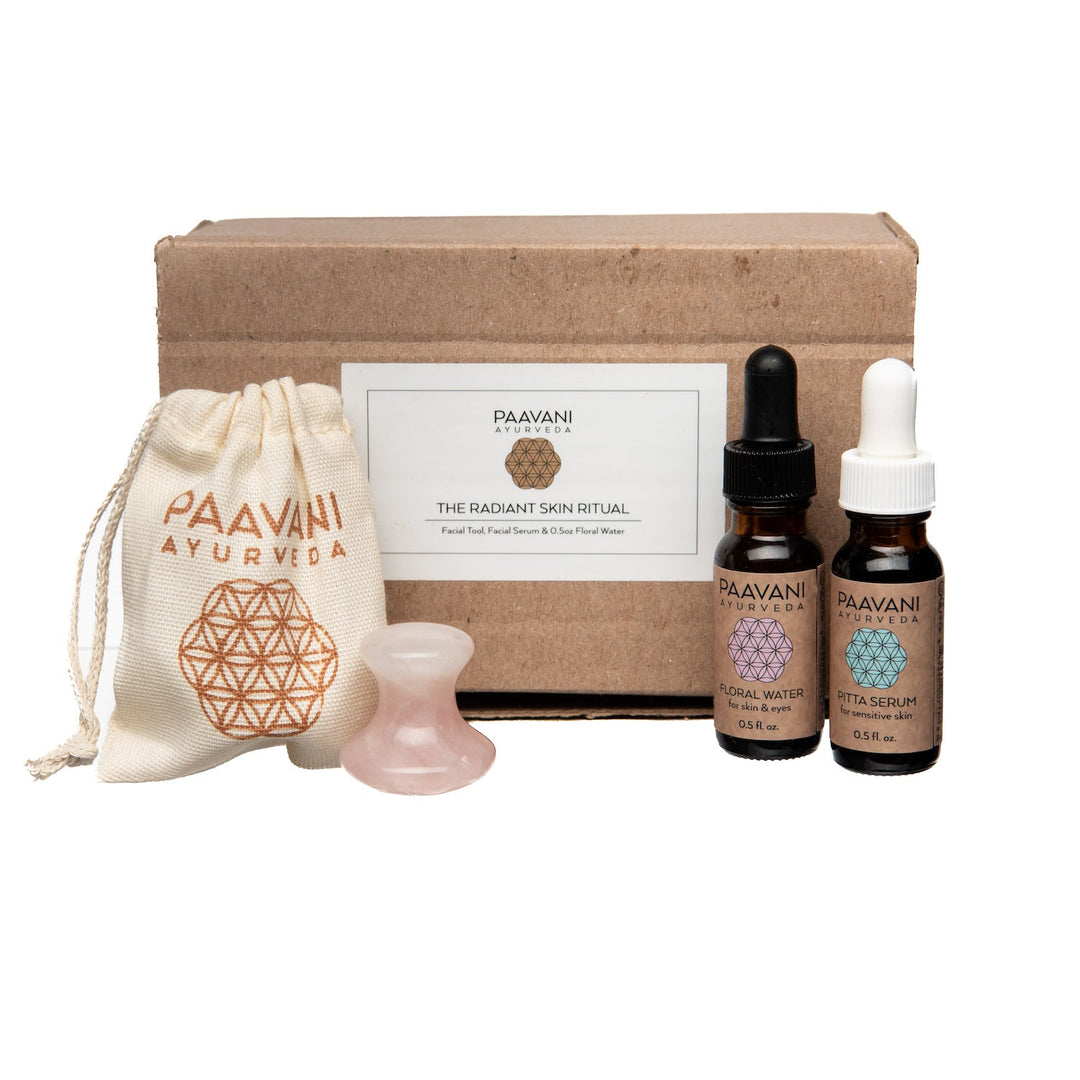 Rose quartz facial tool with a smooth, polished surface.