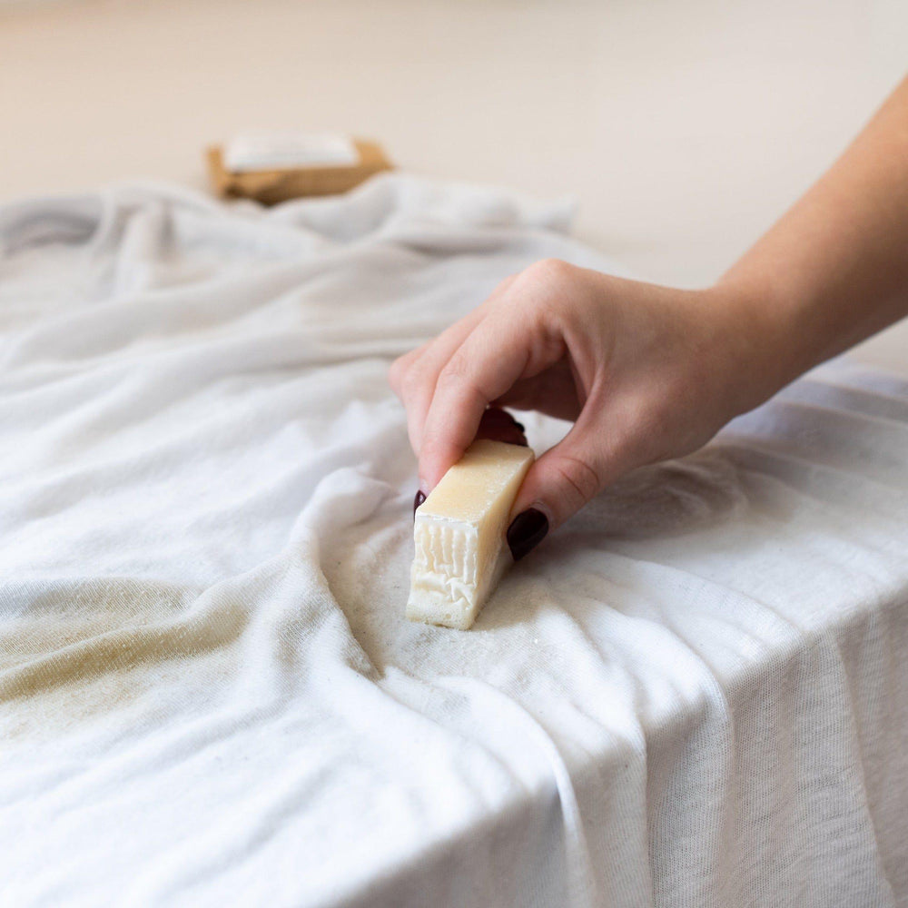 Olive-oil laundry stain stick shown with its packaging.
