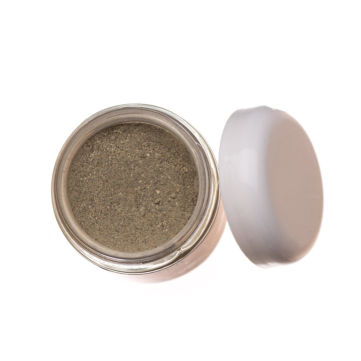 Kapha cleanser and mask with French green clay in skincare jars.